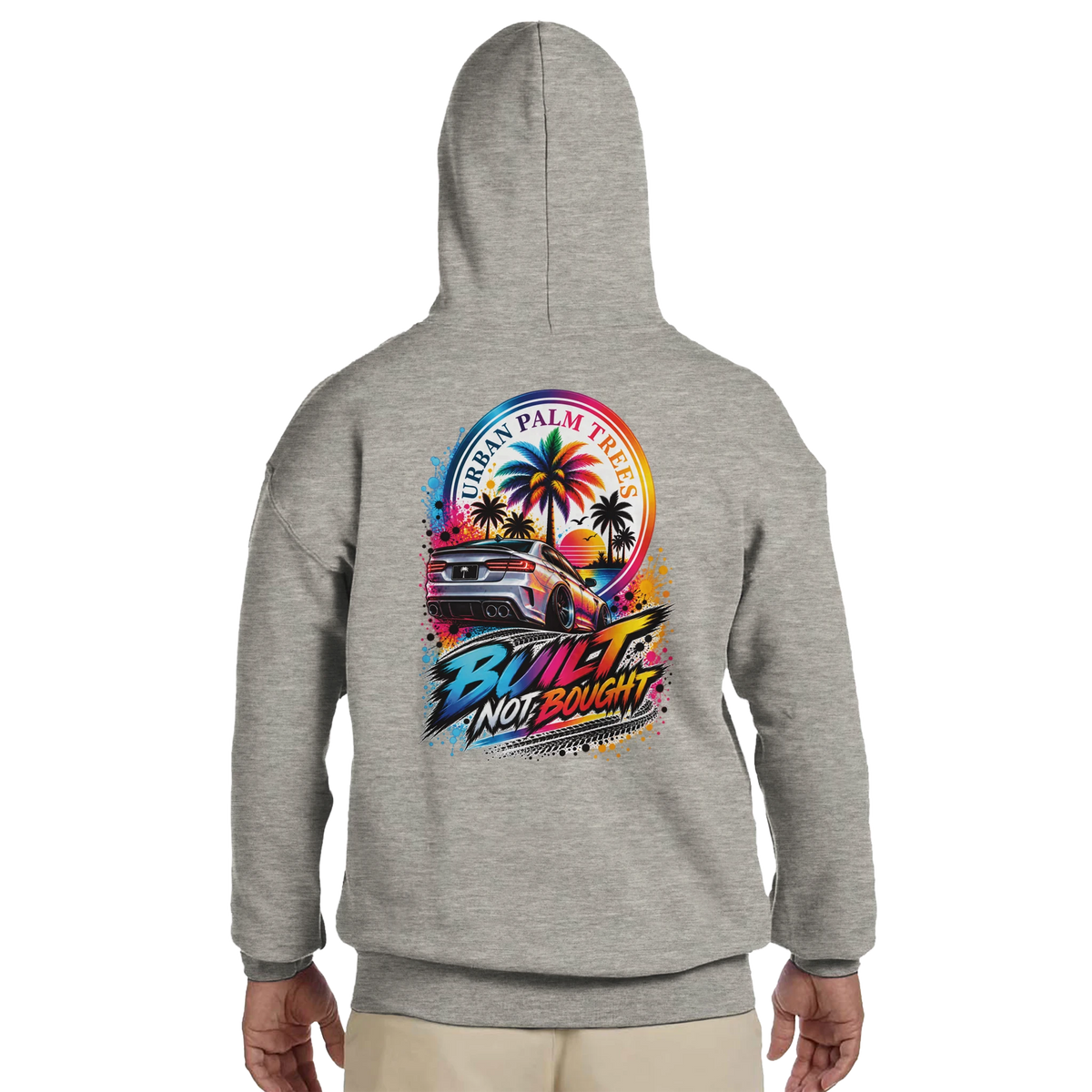 Grey men's hoodie featuring a colorful "Built Not Bought" car graphic with palm trees and sunset on the back. Petrolhead streetwear sweatshirt.