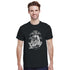 Male model wearing black Gothic Glory graphic T-shirt with silver statue motif and 'Glory' script.