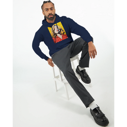 Man wearing navy vintage pop art woman hoodie with retro graphic, styled with grey trousers and black loafers for streetwear look.