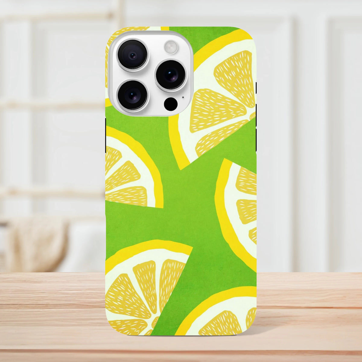 Green iPhone case with bold yellow lemon slice pattern. Shock-absorbing citrus fruit phone cover for urban commutes and drop protection.