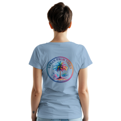 Back view of a woman wearing a light blue Vintage Palm Tree graphic tee featuring a tropical palm circle design.