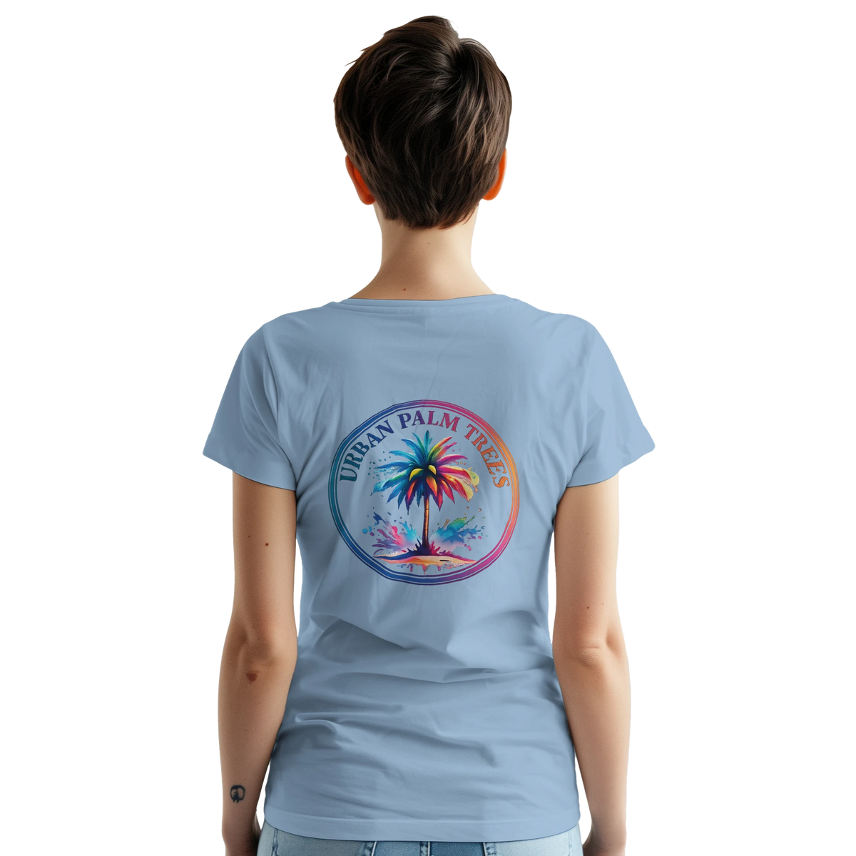 Back view of a woman wearing a light blue Vintage Palm Tree graphic tee featuring a tropical palm circle design.