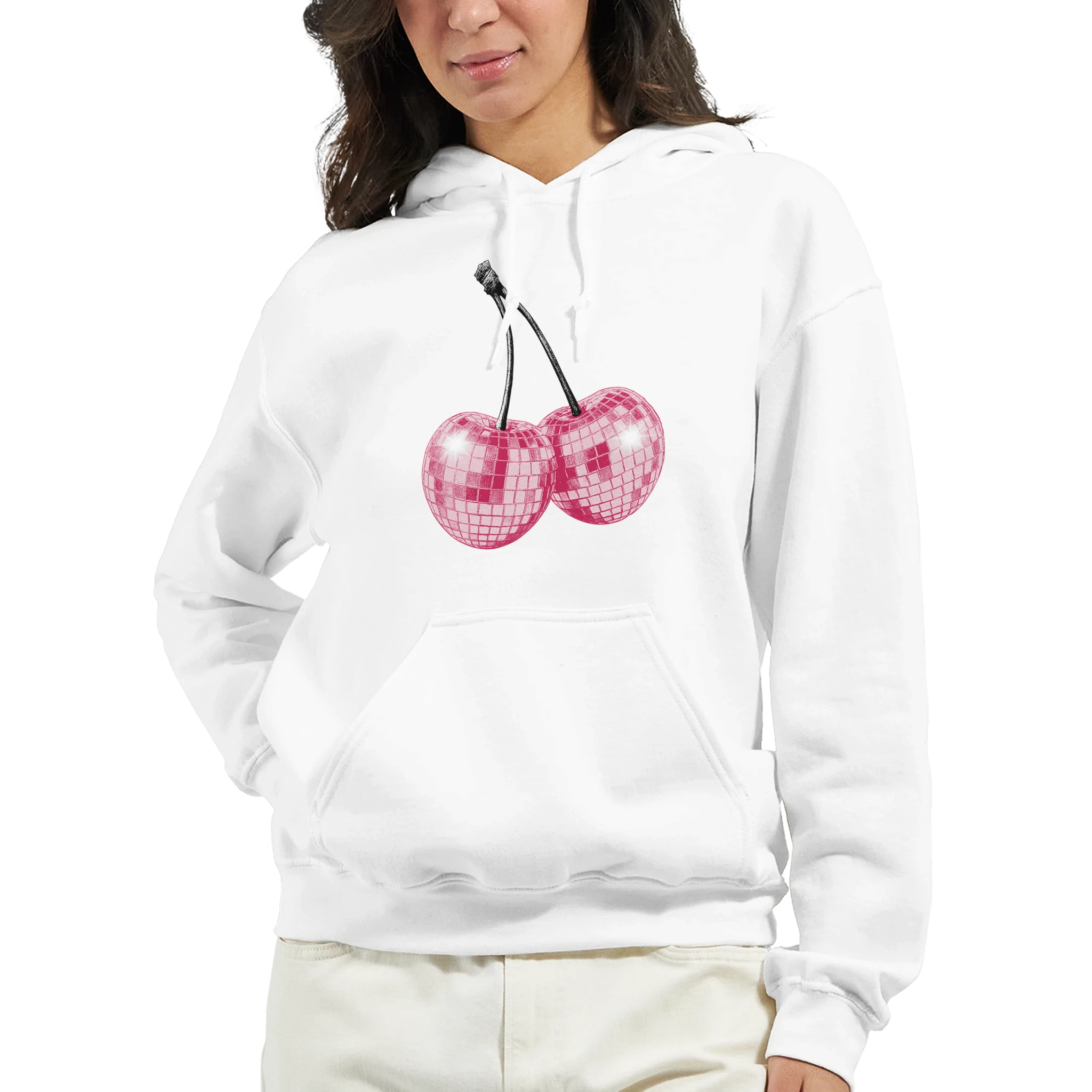 Woman wearing a white cotton-blend hoodie with pink glitter cherries graphic and a front pocket.
