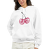 Woman wearing a white cotton-blend hoodie with pink glitter cherries graphic and a front pocket.