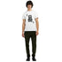 Male model wearing white cotton-blend King graphic T-shirt featuring crowned skull design.