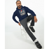 Man wearing navy Car Jumper JDM Hoodie with urban car print, seated on a stool.