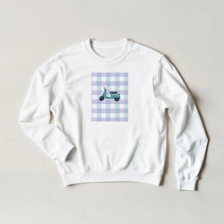 White crewneck sweatshirt featuring a retro scooter graphic on a pastel blue and purple gingham background.