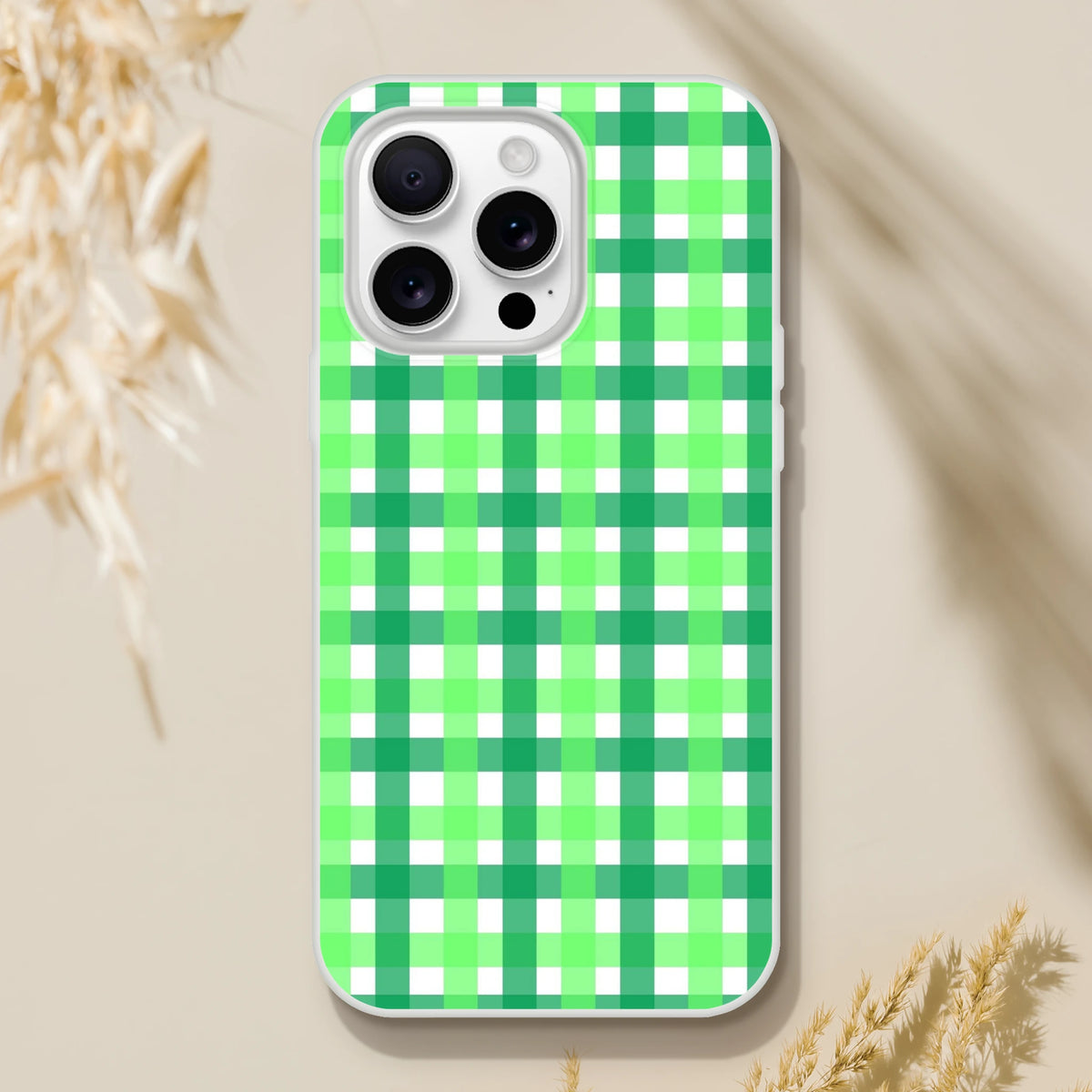 Green gingham iPhone case with lime-green checkered pattern on white phone.