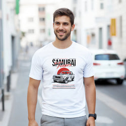 Smiling man wearing a white Japanese JDM graphic T-shirt featuring a vintage car.