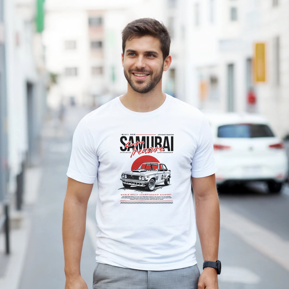 Smiling man wearing a white Japanese JDM graphic T-shirt featuring a vintage car.