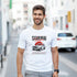 Smiling man wearing a white Japanese JDM graphic T-shirt featuring a vintage car.