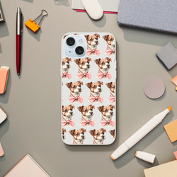 Transparent iPhone case with a repeating pattern of puppies wearing pink bows on a white background.