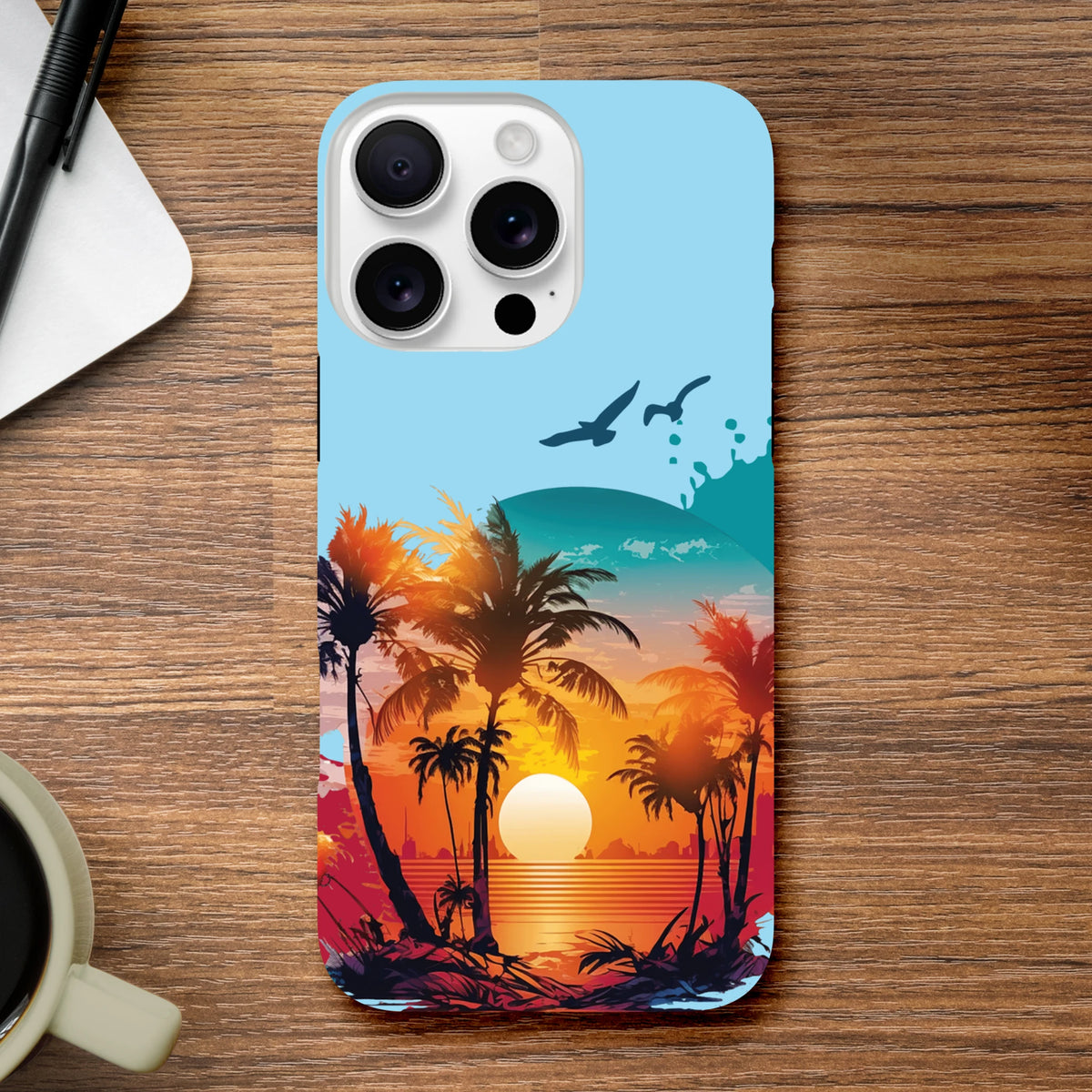 Tropical sunset iPhone case featuring palm tree silhouettes, flying seagulls, and vibrant orange ocean horizon on a tough beach phone cover.