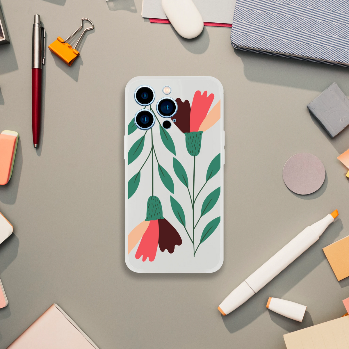 Slim floral phone case with frosted clear finish for iPhone 13–16 featuring green leaves and coral flowers.