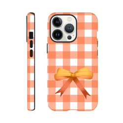 Orange gingham pattern iPhone case with a 3D coquette bow. Tough, impact-resistant phone cover featuring a bold check design for daily protection.