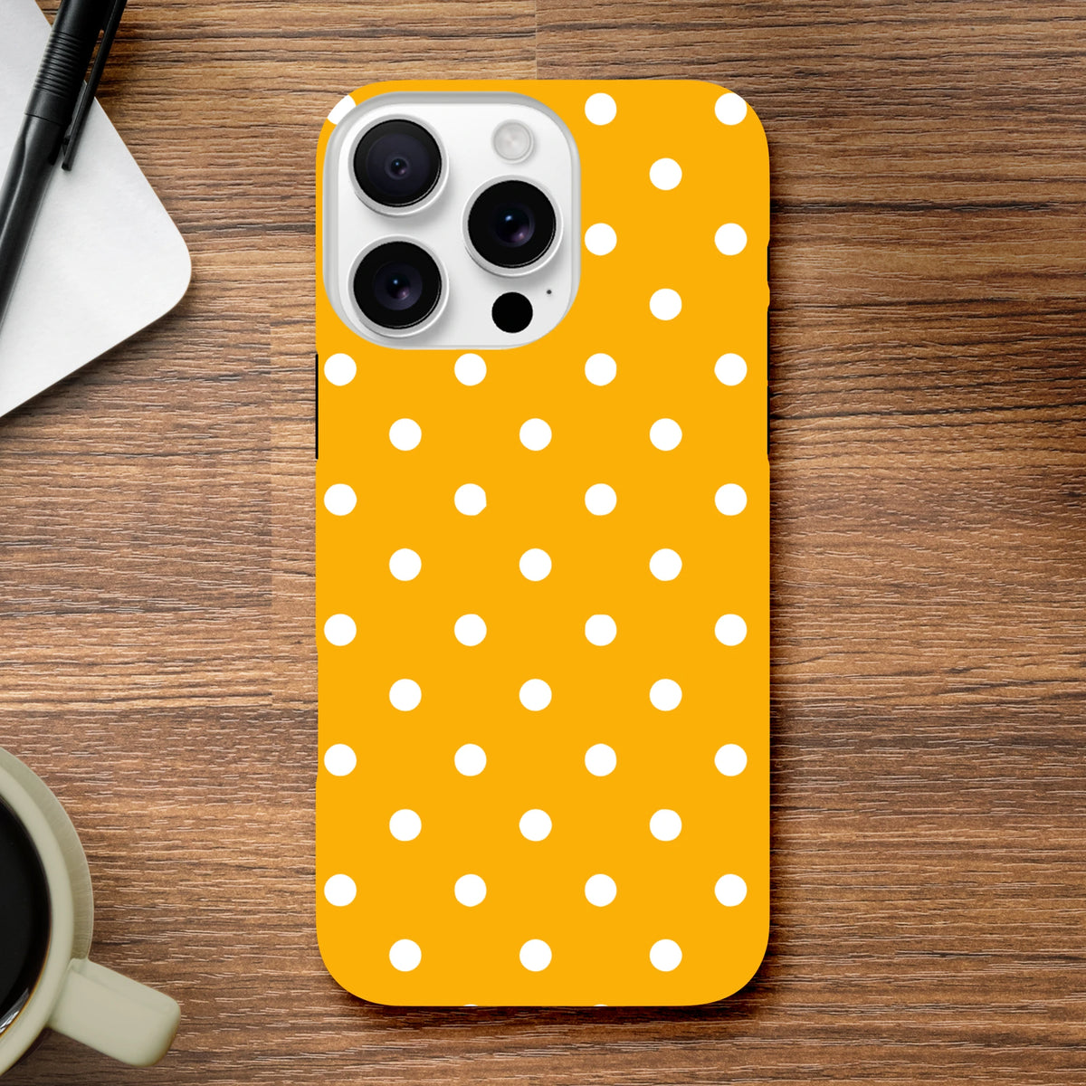 Orange & white polka dot tough iPhone case with shock-absorbing TPU shell for models 13-16. Cute phone cover with exact port access.