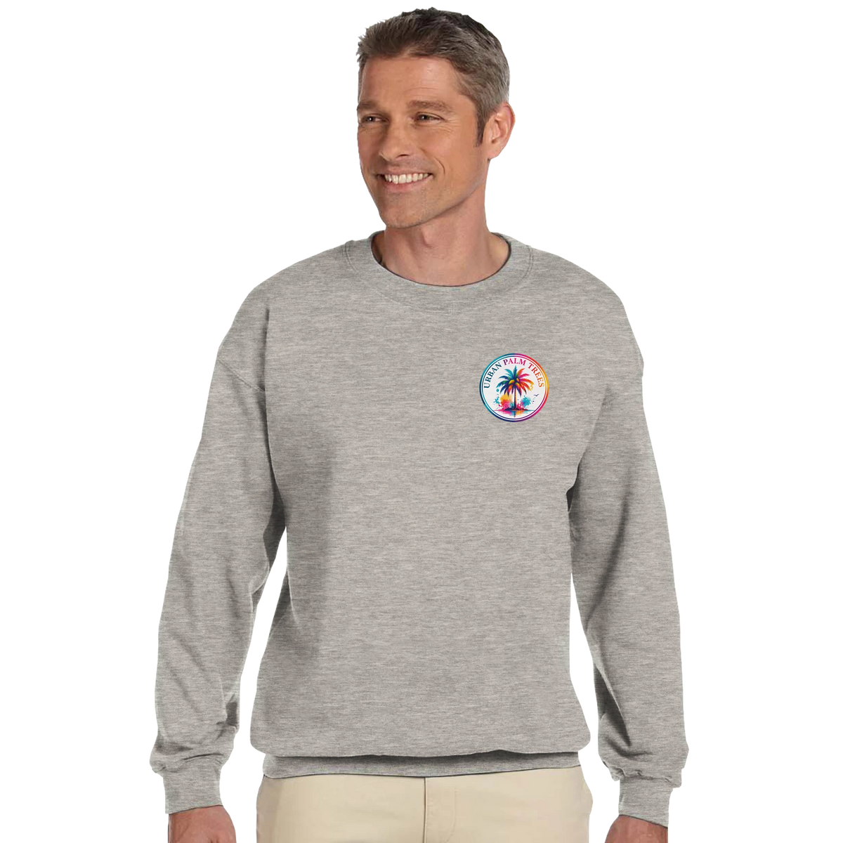 Grey crewneck sweatshirt featuring a colorful Urban Palm Trees logo on the chest. Long sleeves and soft brushed interior for comfort.
