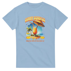 Light blue cotton-blend women's tee with tropical cocktail graphic, palm trees and umbrella.