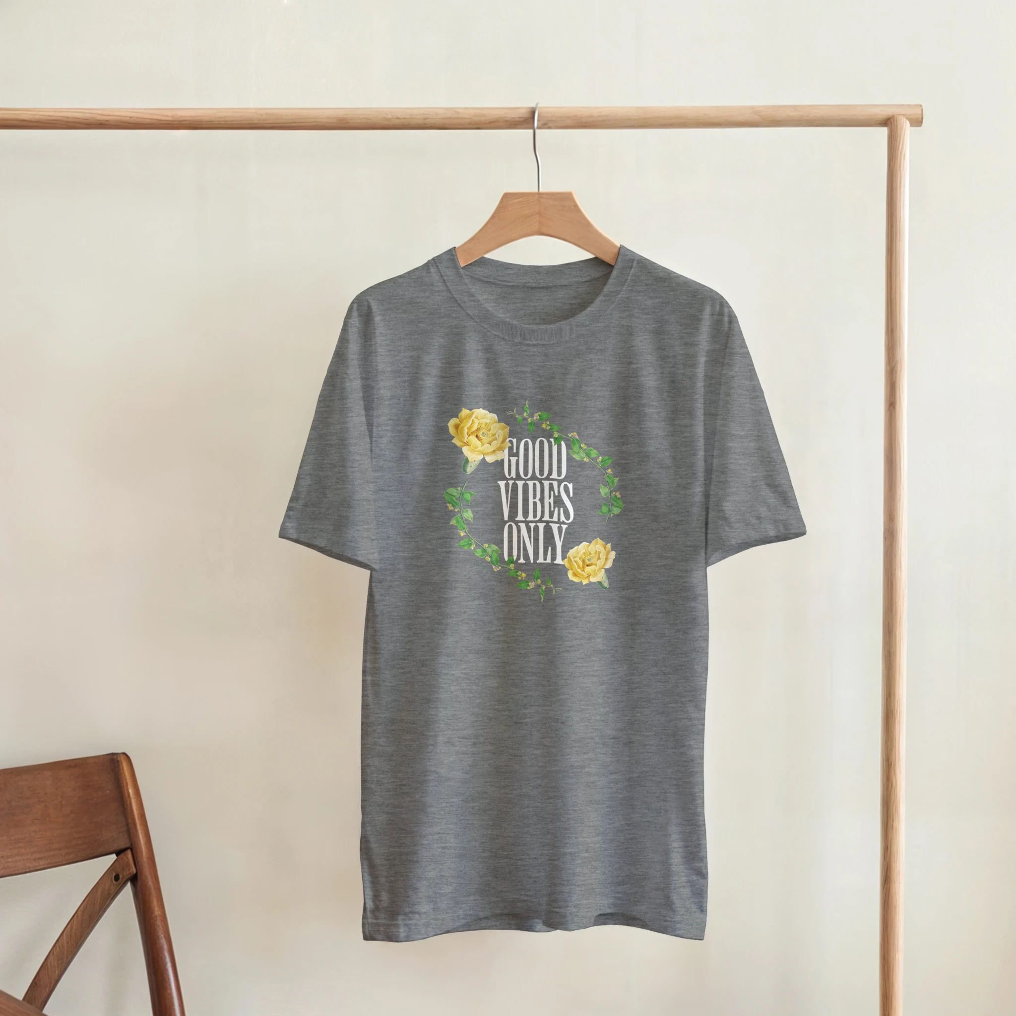 Gray women's graphic tee with a green leaf and yellow rose wreath and GOOD VIBES ONLY