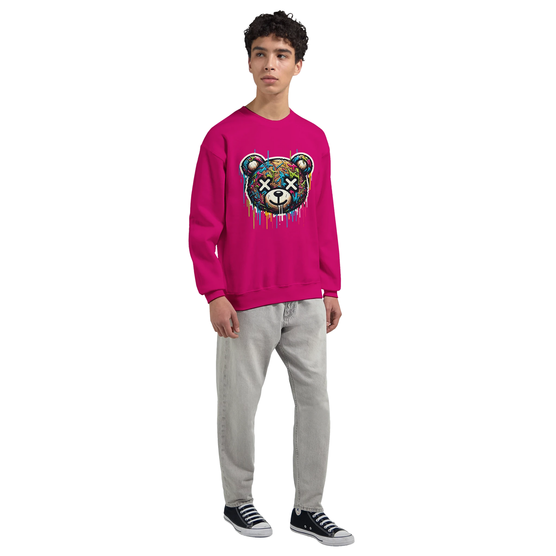 Person wearing a pink men's graphic sweatshirt with a colorful bear design on a white background mid view