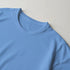 Close-up of a soft cotton-blend men's T-shirt in light blue with a crew neck.