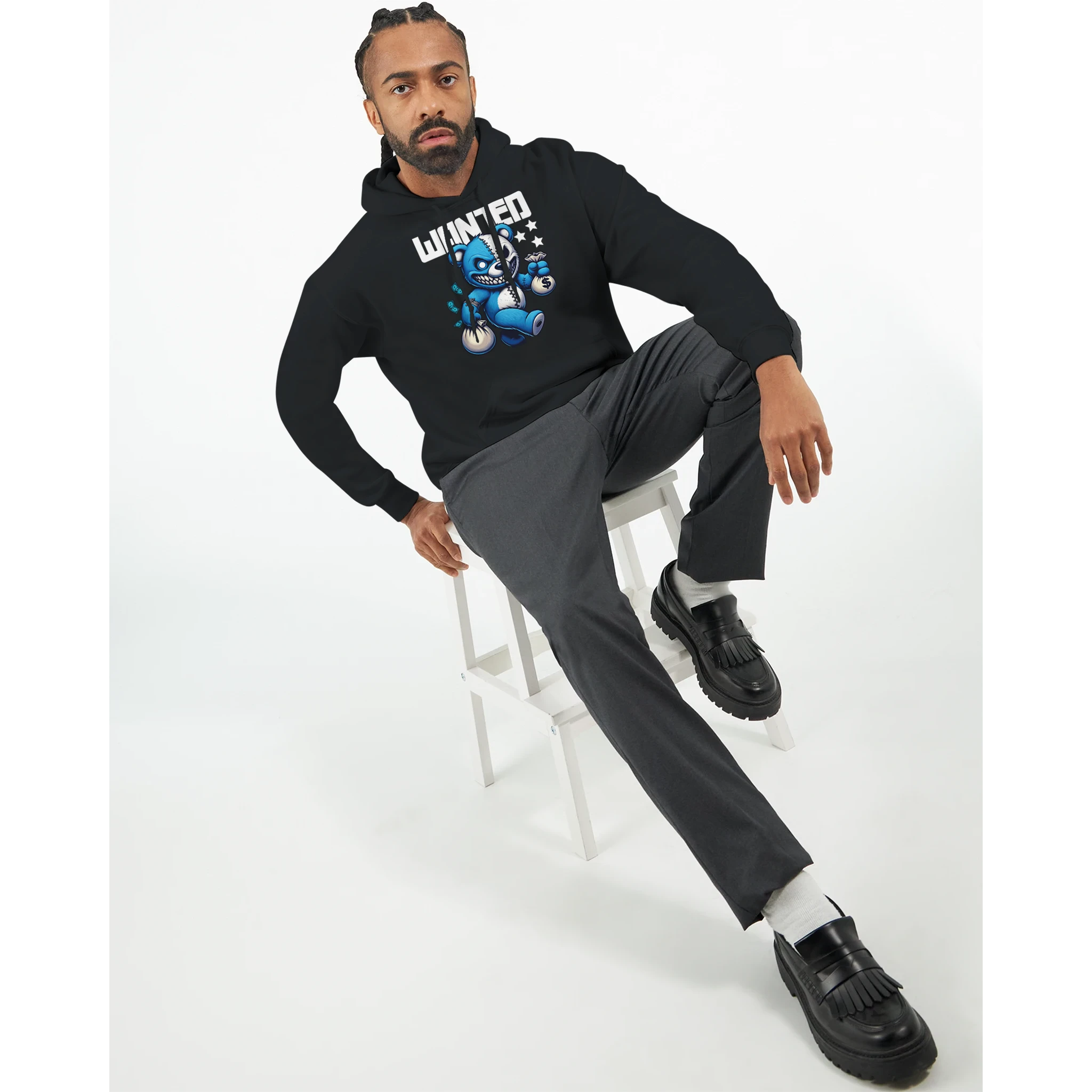 Man wearing black Men's Wanted Teddy Bear Hoodie with blue teddy bear graphic.