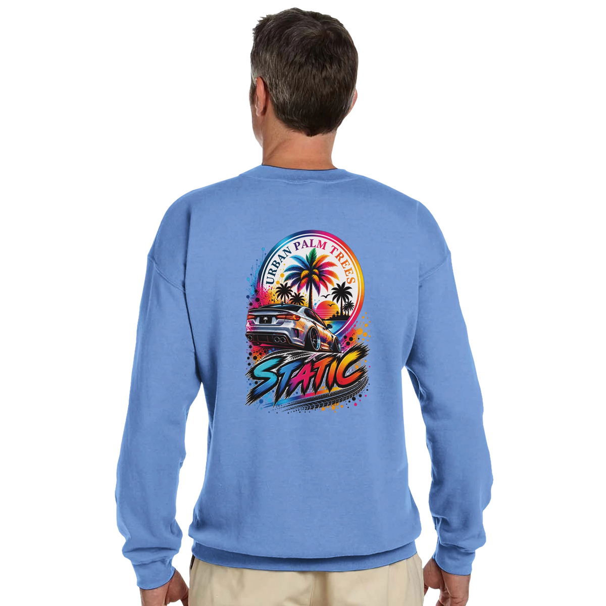Blue crewneck sweatshirt featuring a vibrantStatic petrolhead graphic with a slammed car, palm trees, and Urban Palm Trees text.