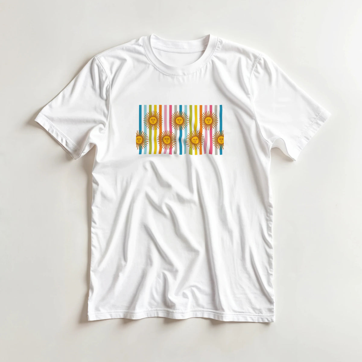 White women's tee featuring retro rainbow sun graphic with vertical color stripes, boho aesthetic.