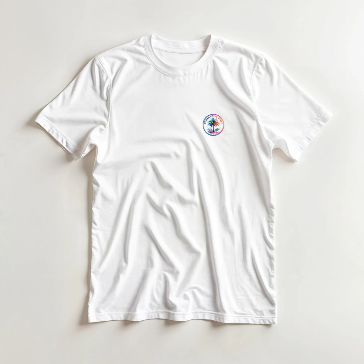 White men's T-shirt featuring a vintage palm tree graphic inside a circular tropical badge on the chest.