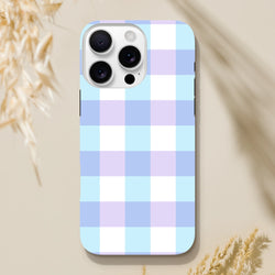 Pastel blue and lavender gingham tough iPhone case providing shock-absorbing protection with a cute checkered streetwear design.