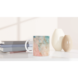 Pastel marble mug in peach and aqua with abstract ceramic design and comfy grip for coffee or tea.
