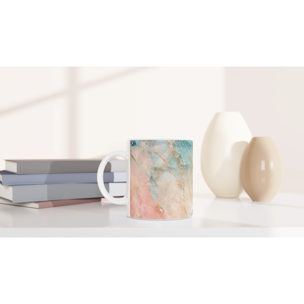 Pastel marble mug in peach and aqua with abstract ceramic design and comfy grip for coffee or tea.