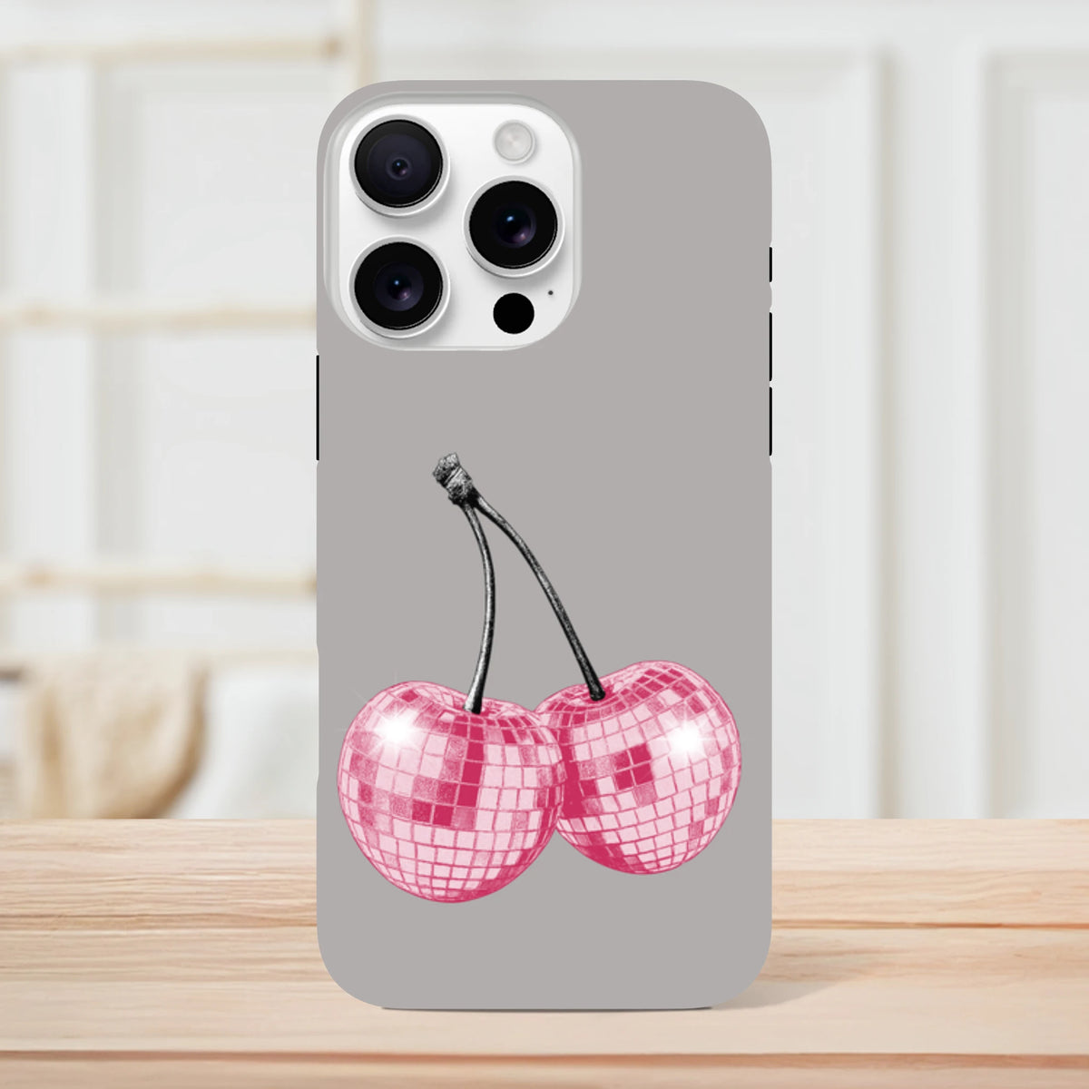 Gray iPhone case featuring pink glitter disco ball cherry design, tough protective fruit phone cover for iPhone 13-16.