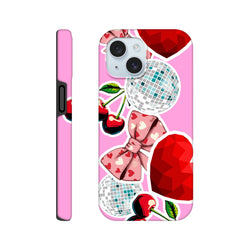 Pink iPhone case featuring sticker-effect cherries, a heart-patterned bow, disco balls, and red geometric hearts on a glossy background.