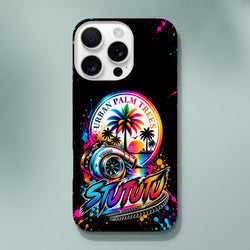 Black iPhone case featuring vibrant turbocharged car art, "Urban Palm Trees" sunset graphic, colorful paint splatters, and stylized "Stututu" lettering.