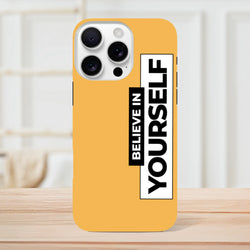 Orange tough iPhone case with high-contrast vertical "Believe In Yourself" slogan print, designed for daily carry protection.