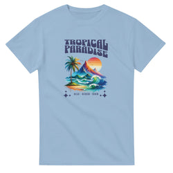 Light blue women's Tropical Paradise graphic tee with palm tree, mountains, waves and sunset.