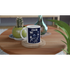 White ceramic mug with navy 'It's OK Not To Be OK' slogan on a wooden coaster, a thoughtful mental health gift.