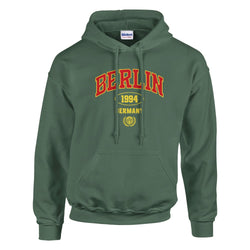 Green Berlin Graphic Women’s Hoodie with yellow and red graphic, soft cotton blend, sizes S–XL.