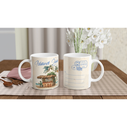 Two retro postcard mugs with island scenery and postal designs on a checkered table.