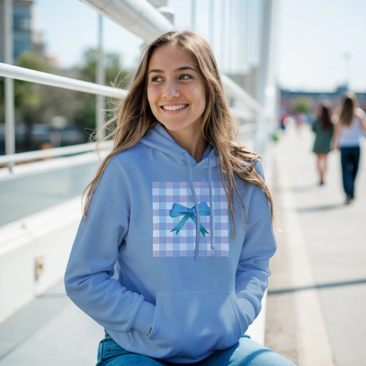 Blue Coquette Graphic Pullover featuring a gingham patch and ribbon bow design on a relaxed fit women's hoodie.
