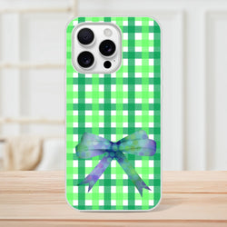 Green Gingham Bow iPhone Case (13-16) in Cute Coquette aesthetic with frosty transparent TPU shell.