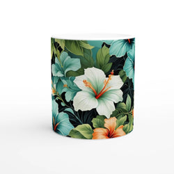 Tropical hibiscus mug with a floral Hawaiian pattern and lush green leaves.
