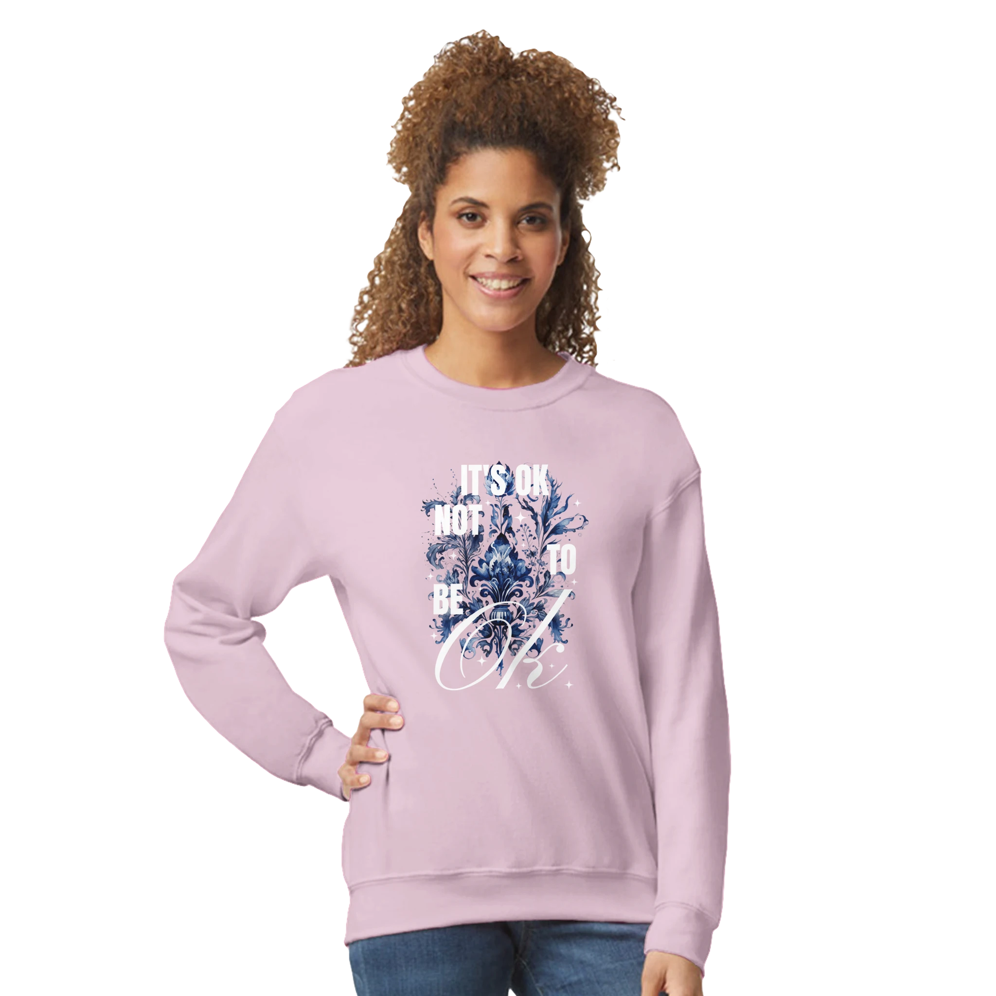 Light pink women's graphic sweatshirt with blue floral art and 'It's OK Not to Be OK' text.