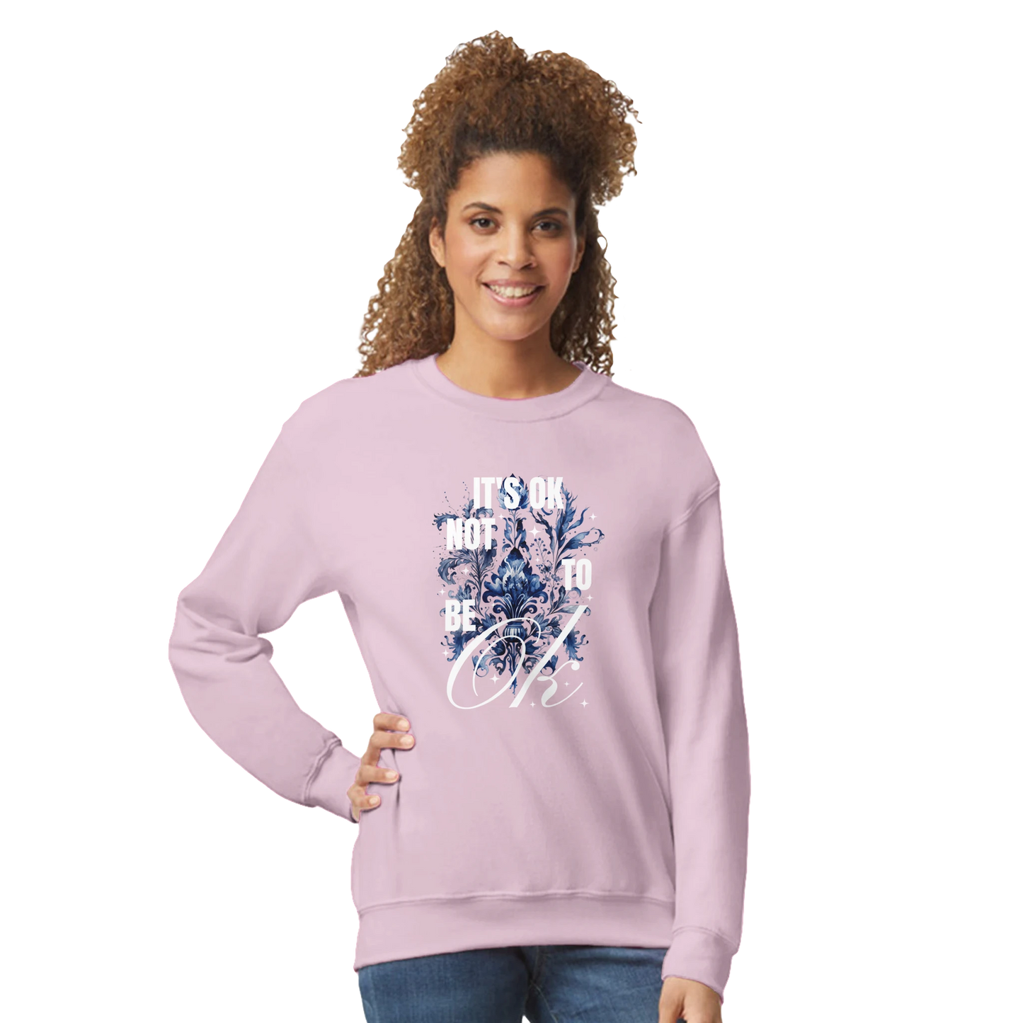 Light pink women's graphic sweatshirt with blue floral art and 'It's OK Not to Be OK' text.