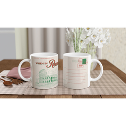 Vintage Rome mug with retro postcard designs, featuring the Colosseum and Roman stamps on a checkered table.