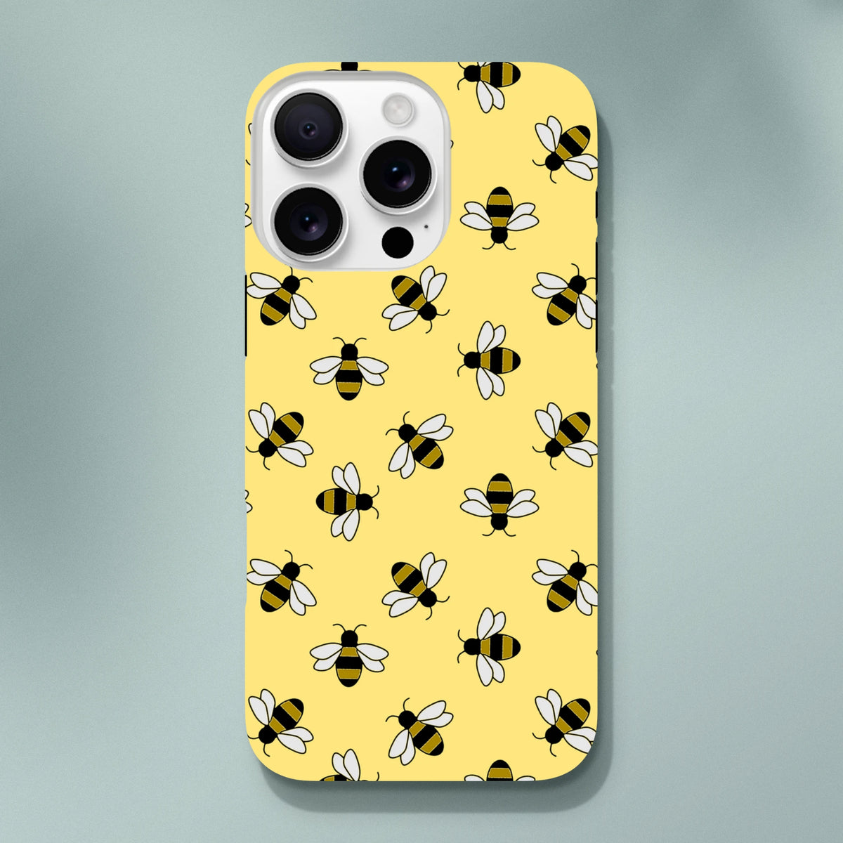Yellow iPhone case featuring a cute repeating pattern of black and yellow bumble bees on a bright background for everyday protection.