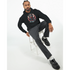 Man wearing black DJ Bear Hoodie with bold graphic, seated on a white stool.