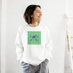 White sweatshirt featuring a green gingham square graphic with a purple bow, capturing a cute coquette aesthetic for casual autumn wear.