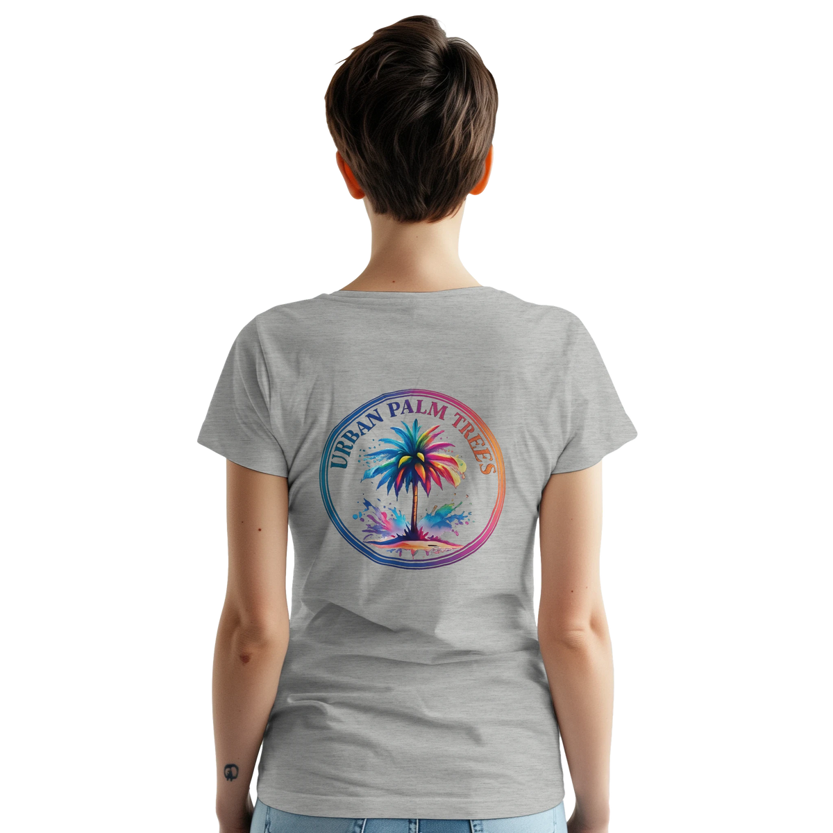 Back view of a woman wearing a gray vintage palm tree graphic tee with a circular rainbow palm design.
